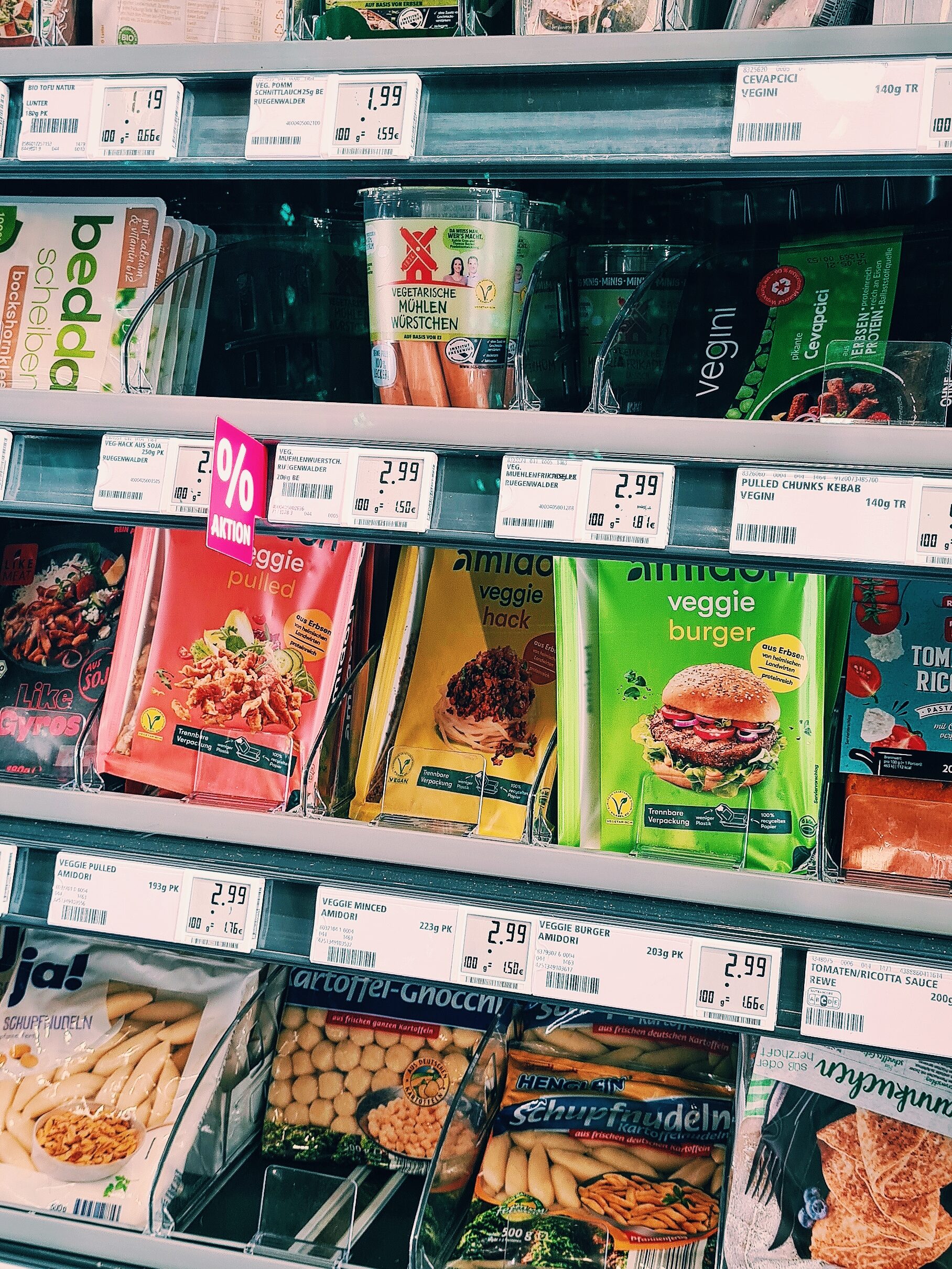 A photo of the refrigeratede vegetarian food section in the local Rewe supermarket.