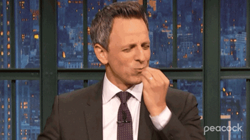 GIF of Seth Meyers blowing a Chef's Kiss.