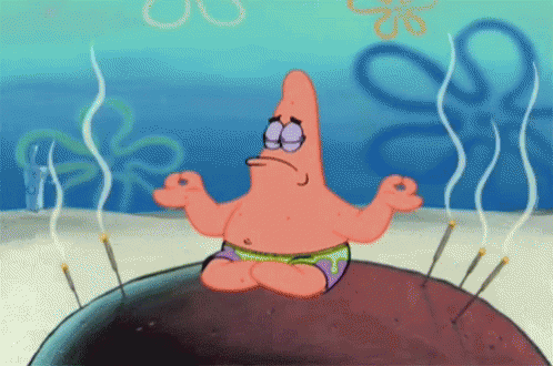 Patrick from Spongebob Squarepants in a mudra yoga pose with incense sticks burning around him.