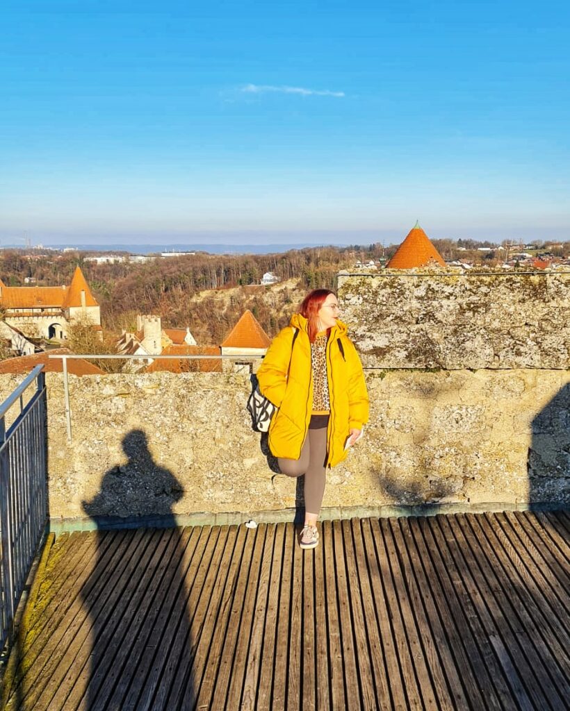 Steffi stands on the viewing platform of the longest castle in the world